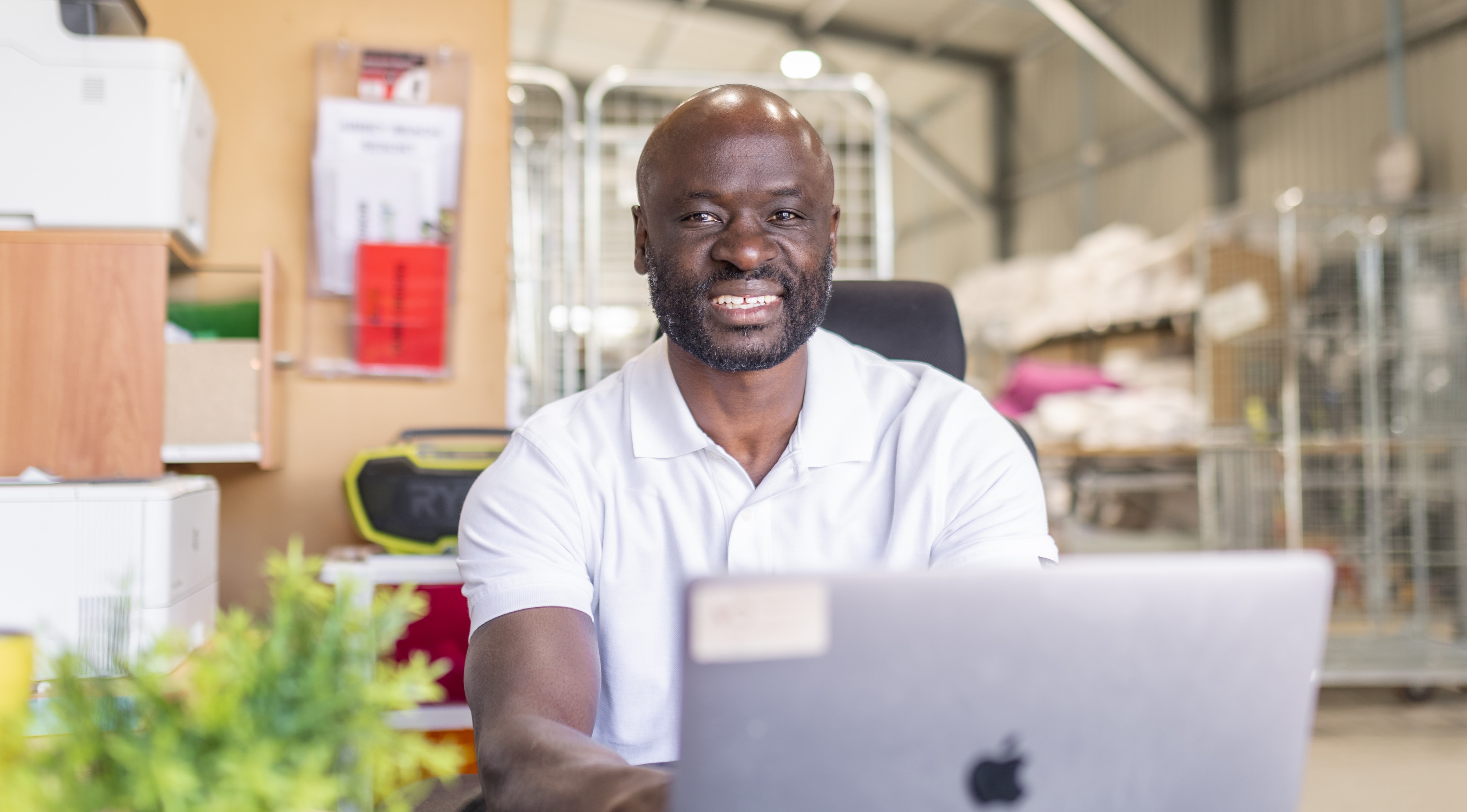 Showing image of man working on laptop.