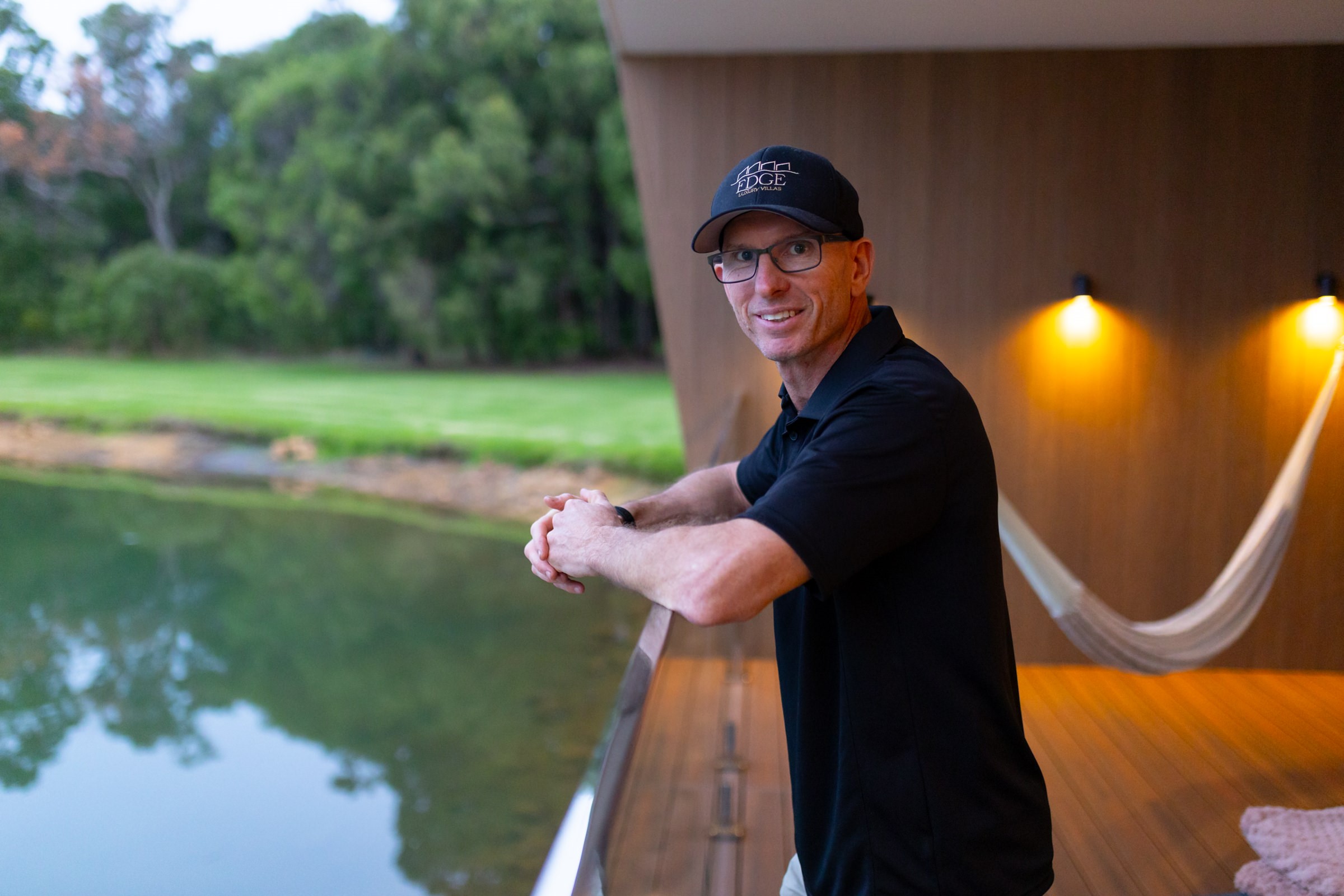 Image of owner, Cameron Kissell, overlooking the lake on Edge Luxury Villas land.