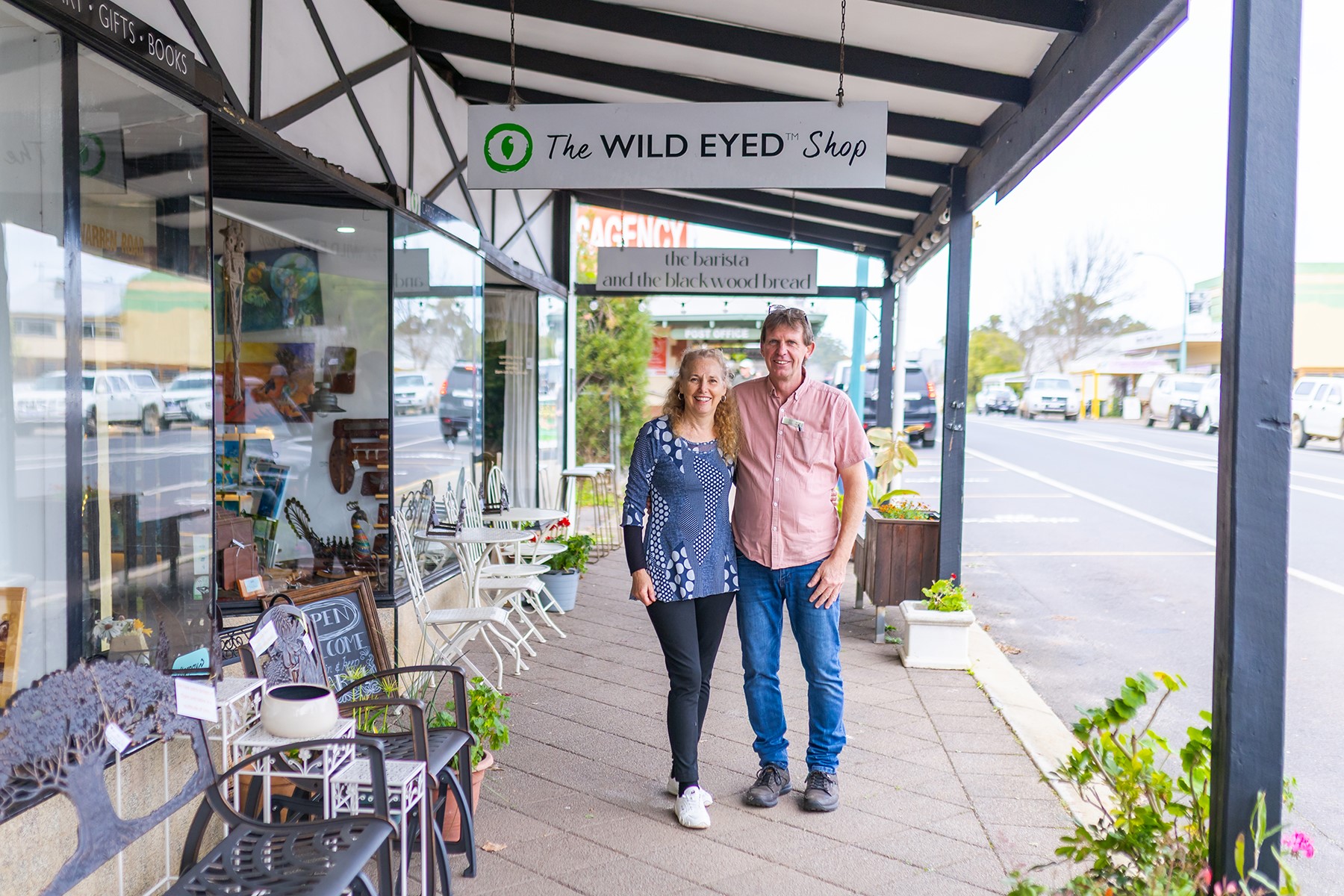 Mark and Leanne White standing out the front of their business, Wild Eyed Press.