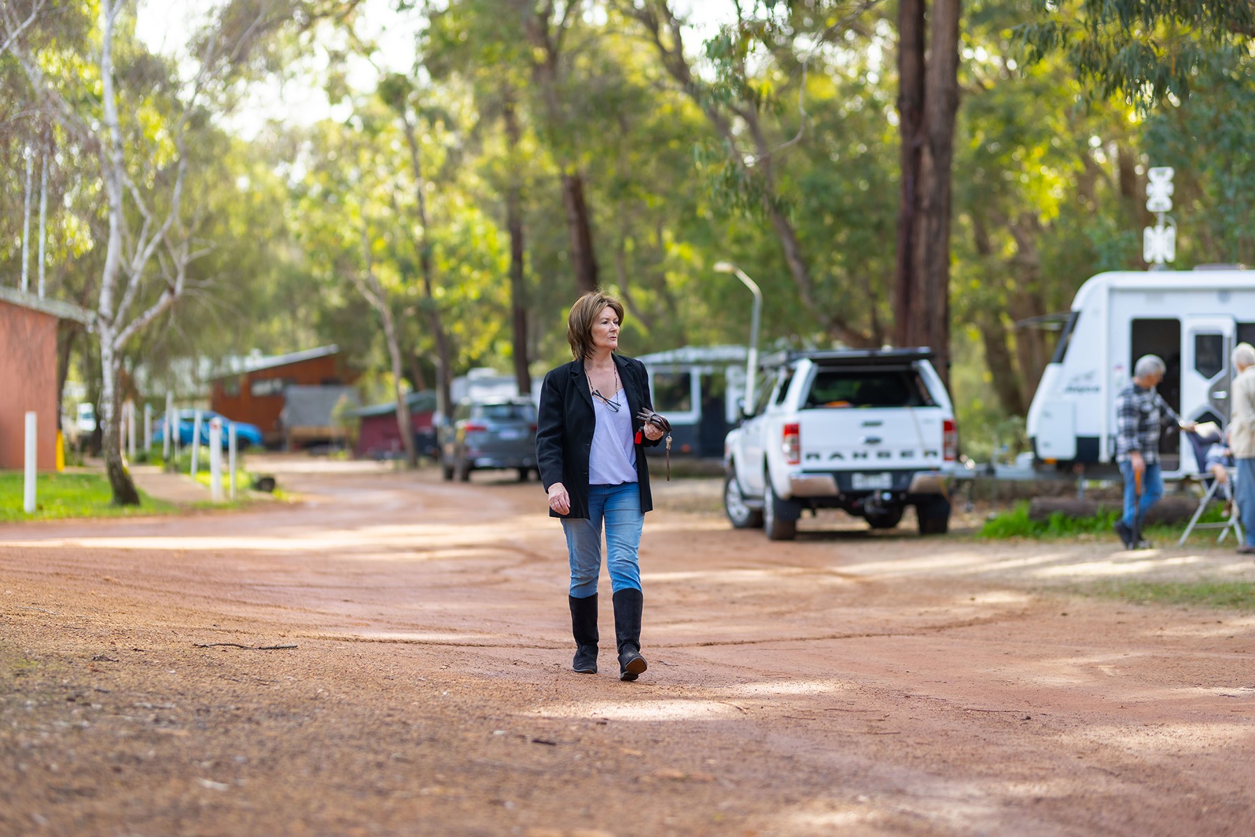 Julie May walking through the grounds of Nannup Caravan Park.