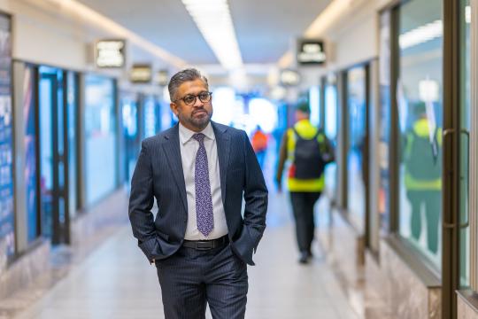 Small Business Commissioner Saj Abdoolakhan walking through Piccadilly Arcade in Perth's CBD.