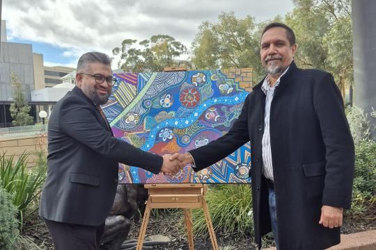 Small Business Commissioner Saj Abdoolakhan with Noongar artist Yondee Shane Hansen.