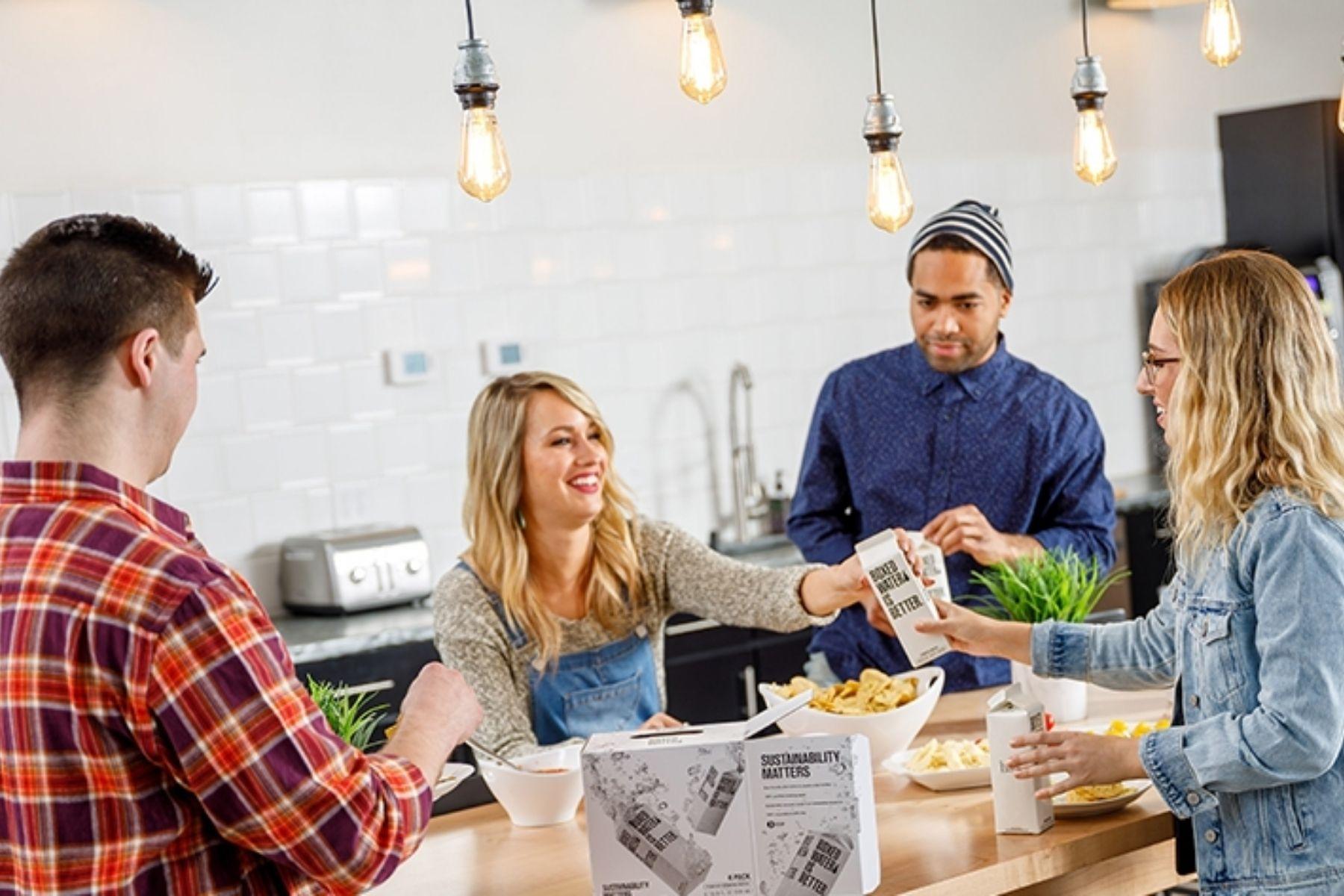 A group of four people cooking together.