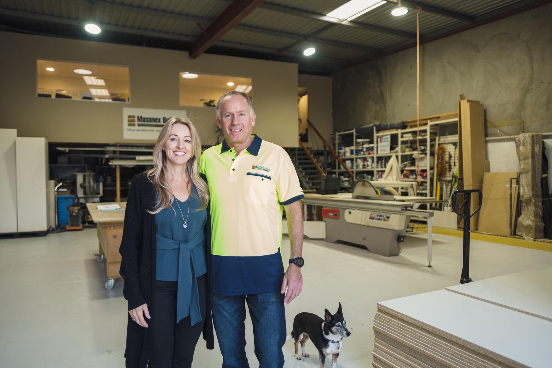 Photo of Julia and Mick Nesbitt standing in the Masonex Building workshop.
