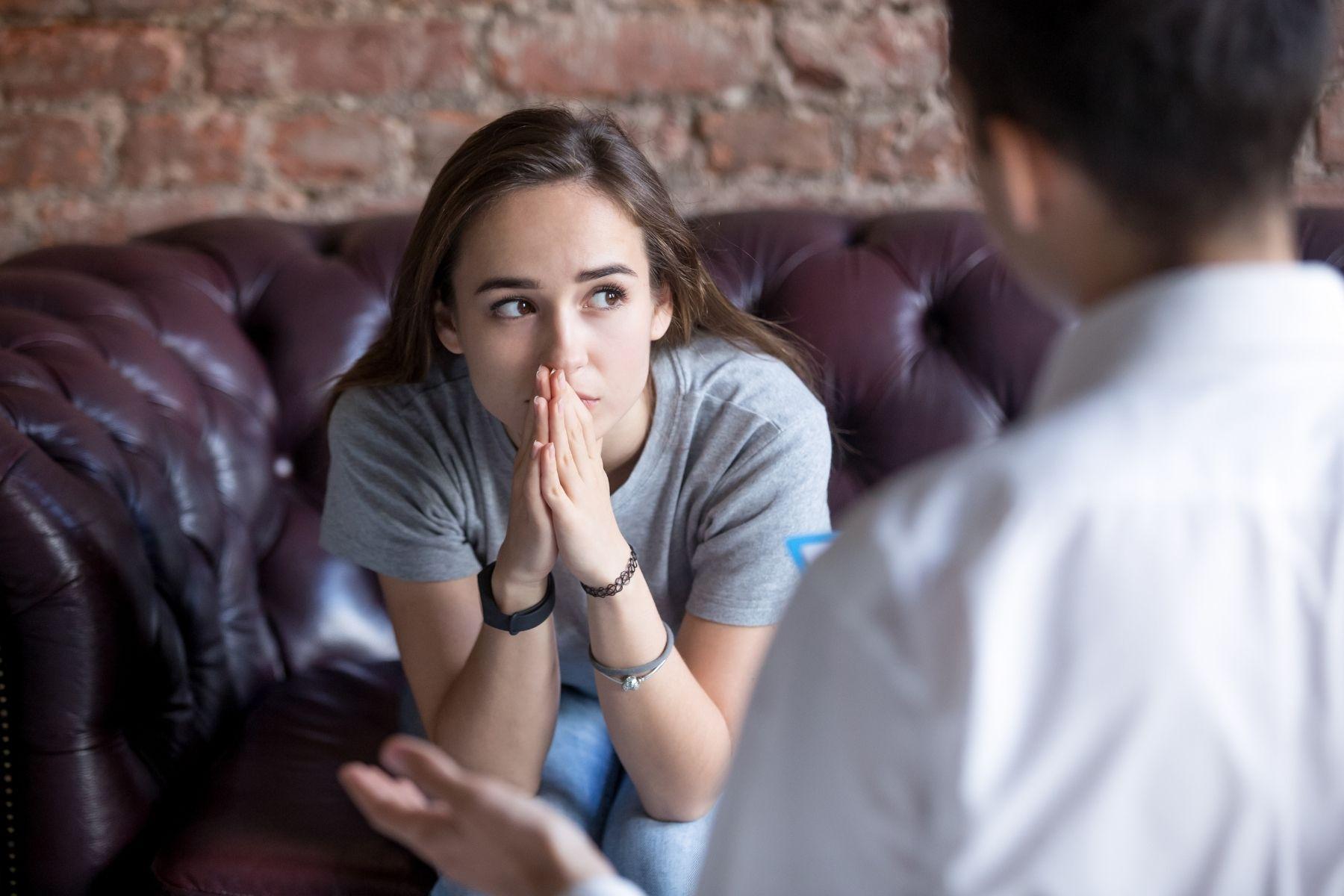 Photo of a distressed person getting advice.