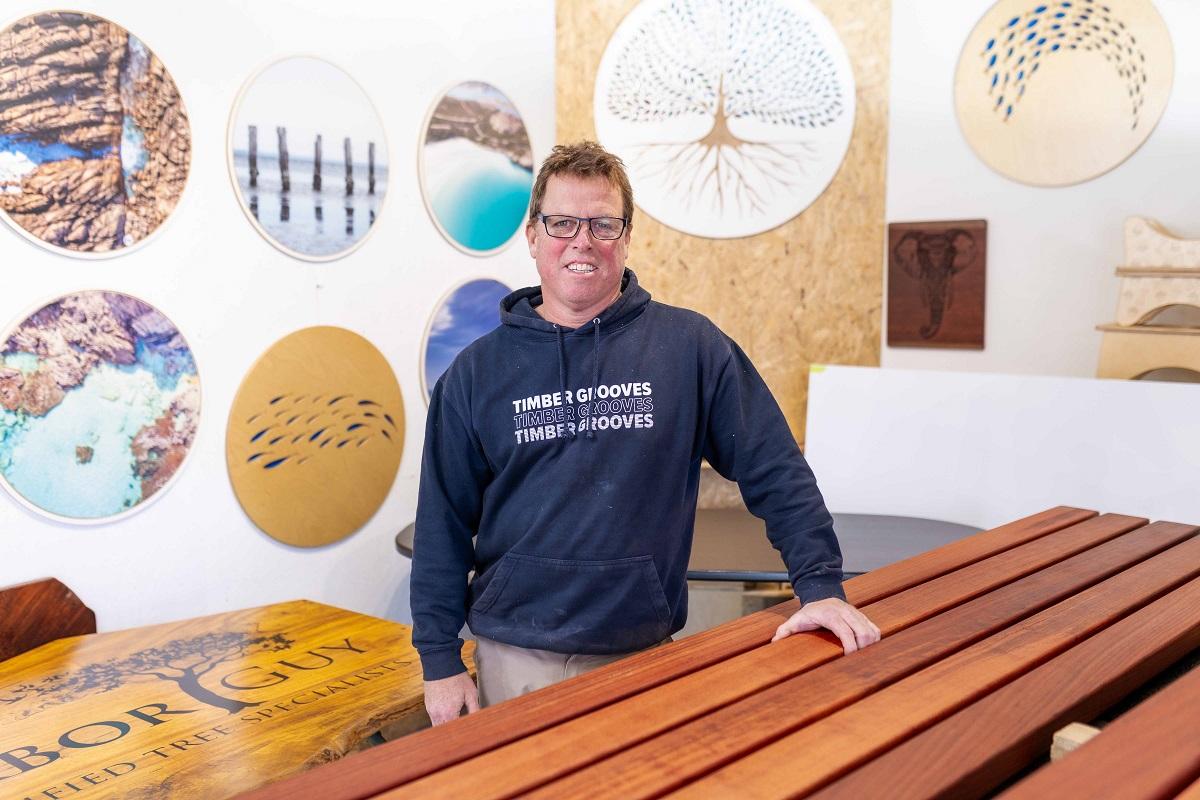 Image of a man in a shop facing the camera
