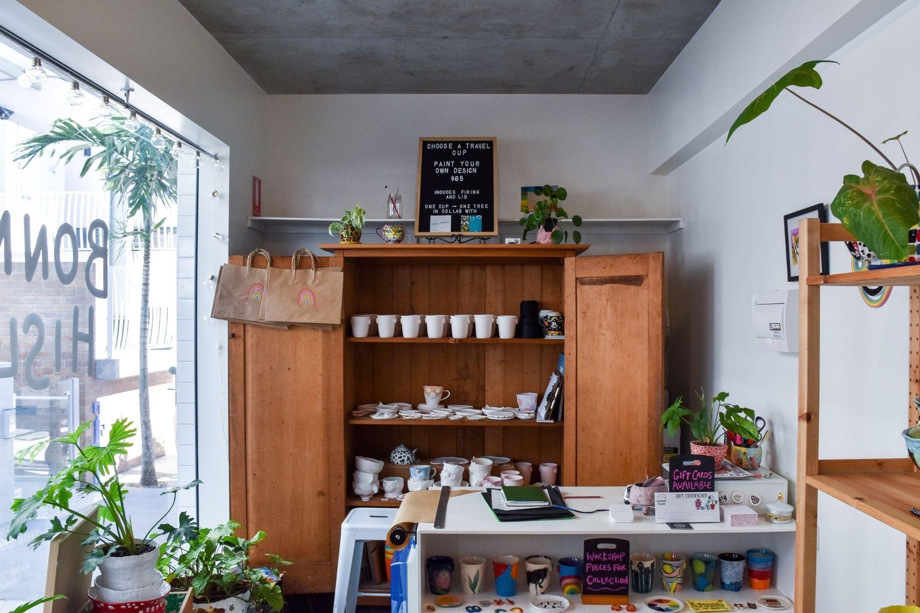 Photo of the shop window and interior of a shop that sell travel cups.