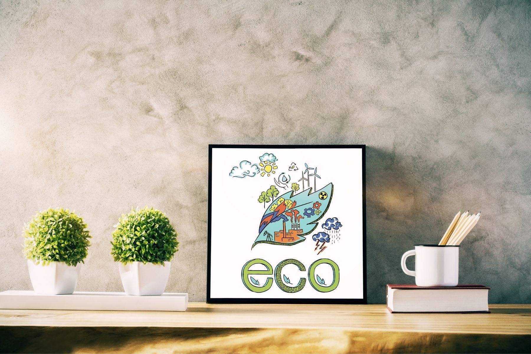 Image of two plants and photo frame on a desk