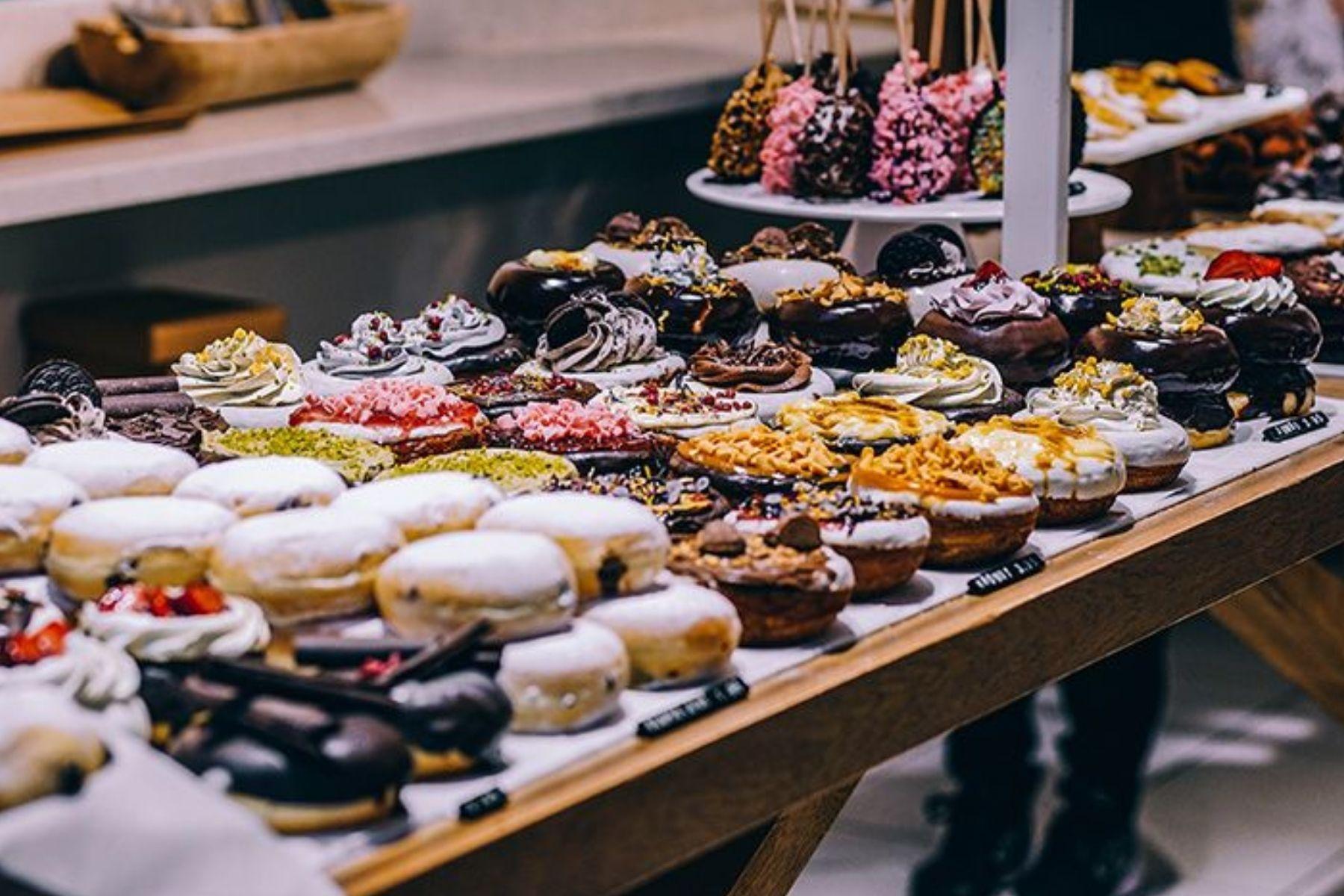 Close up photo of cakes and pastries on display.