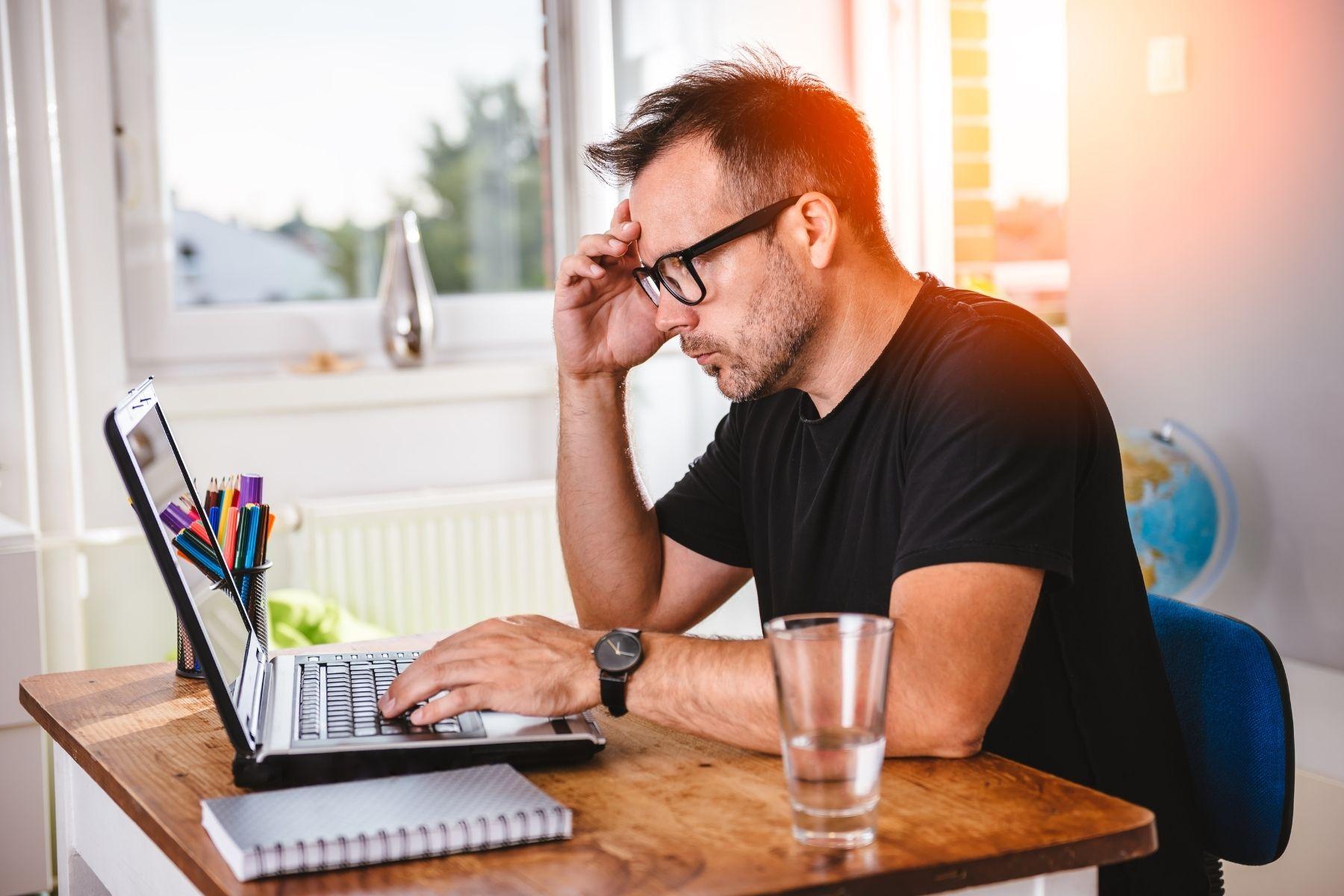 Man working at a laptop at a desk