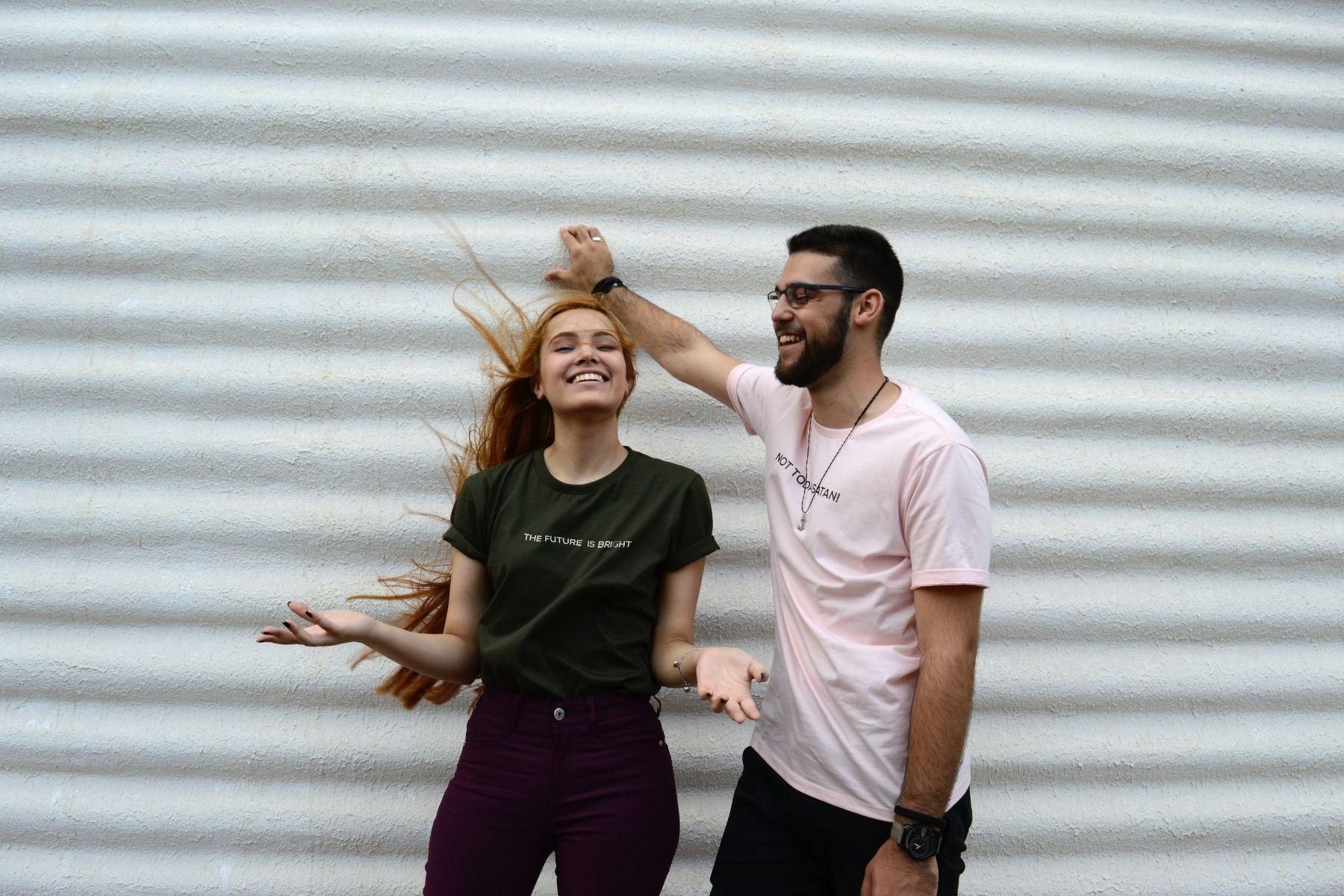 Photo of a young man and young woman in a casual setting.