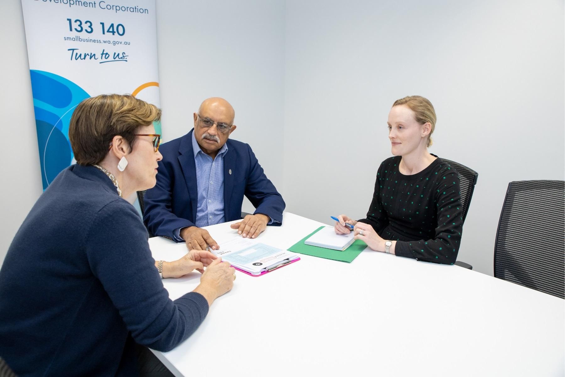 Photo of an SBDC case manager facilitating a conversation.