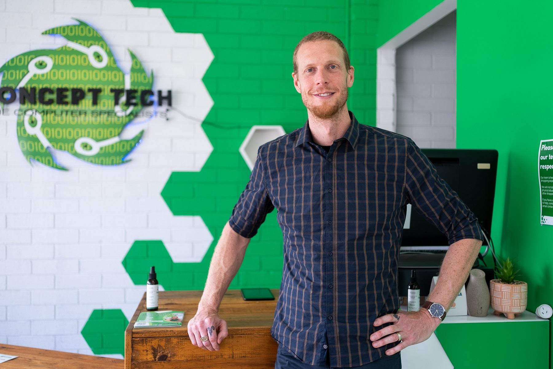 Photo of Jordan Wilson standing in the Concept Tech office.