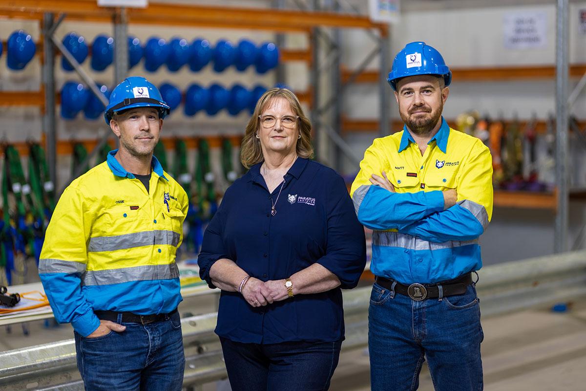 Three staff members from Paratus Training smiling at the camera