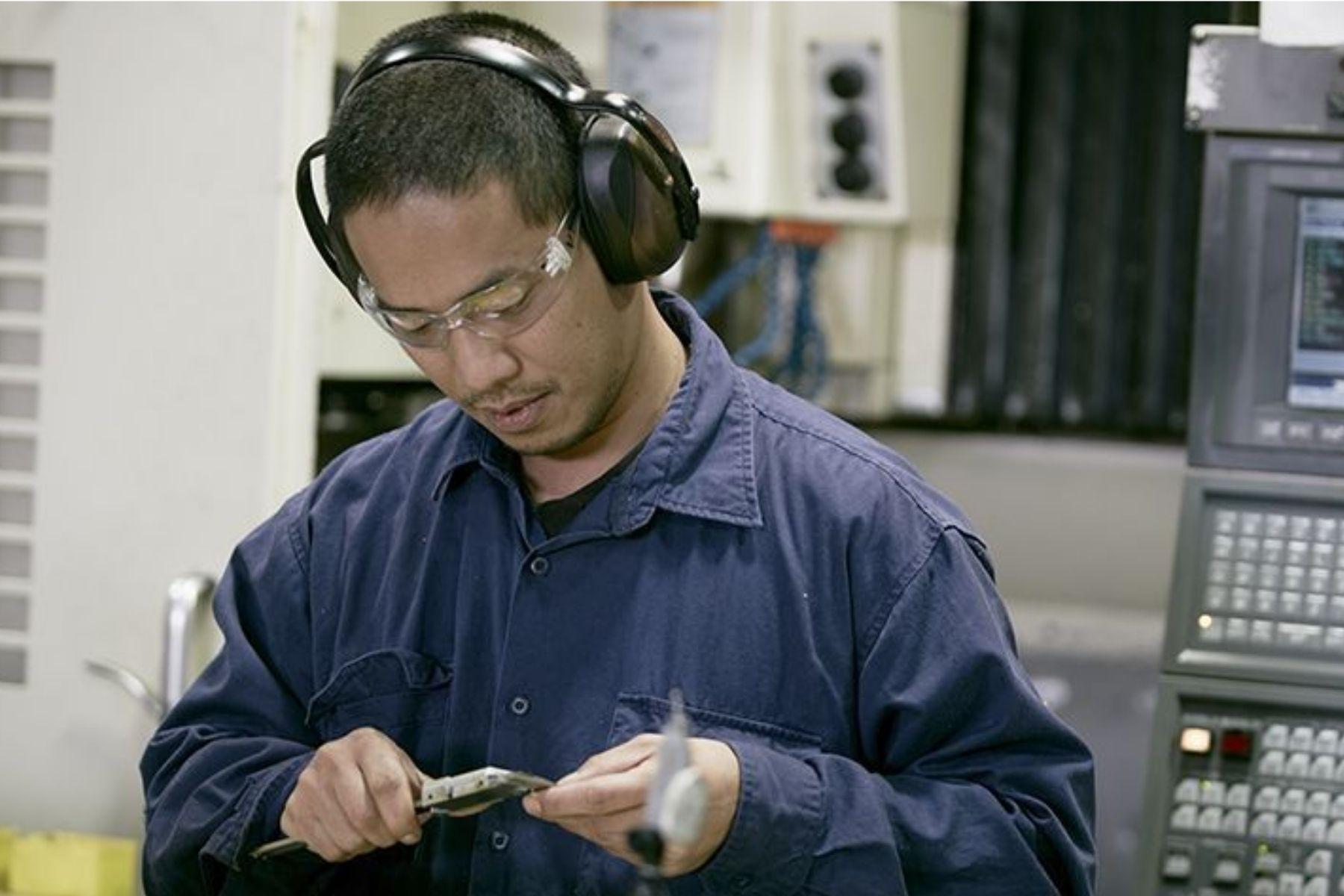 Photo of a man working in a factory.