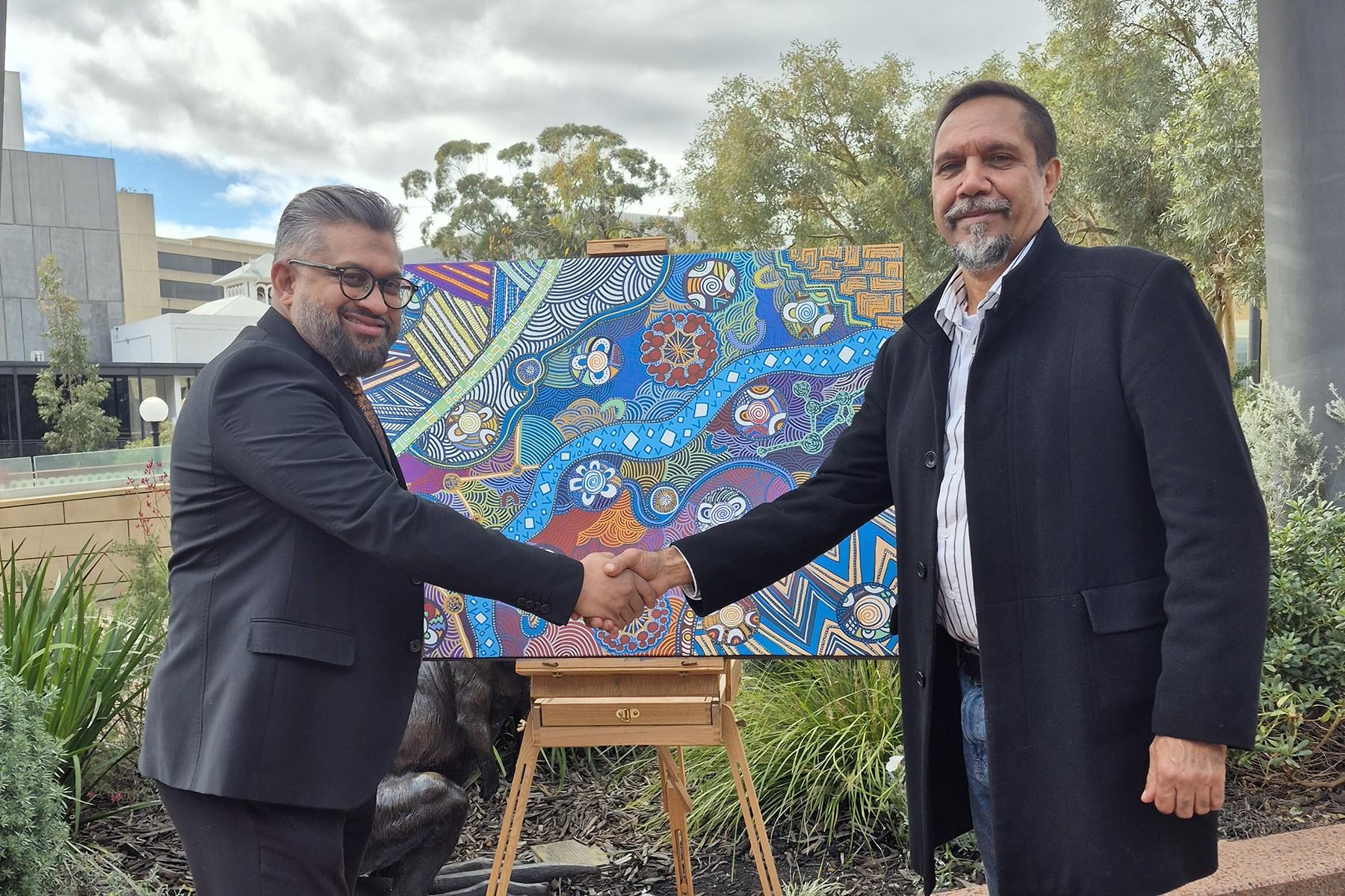 Small Business Commissioner Saj Abdoolakhan with Noongar artist Yondee Shane Hansen.