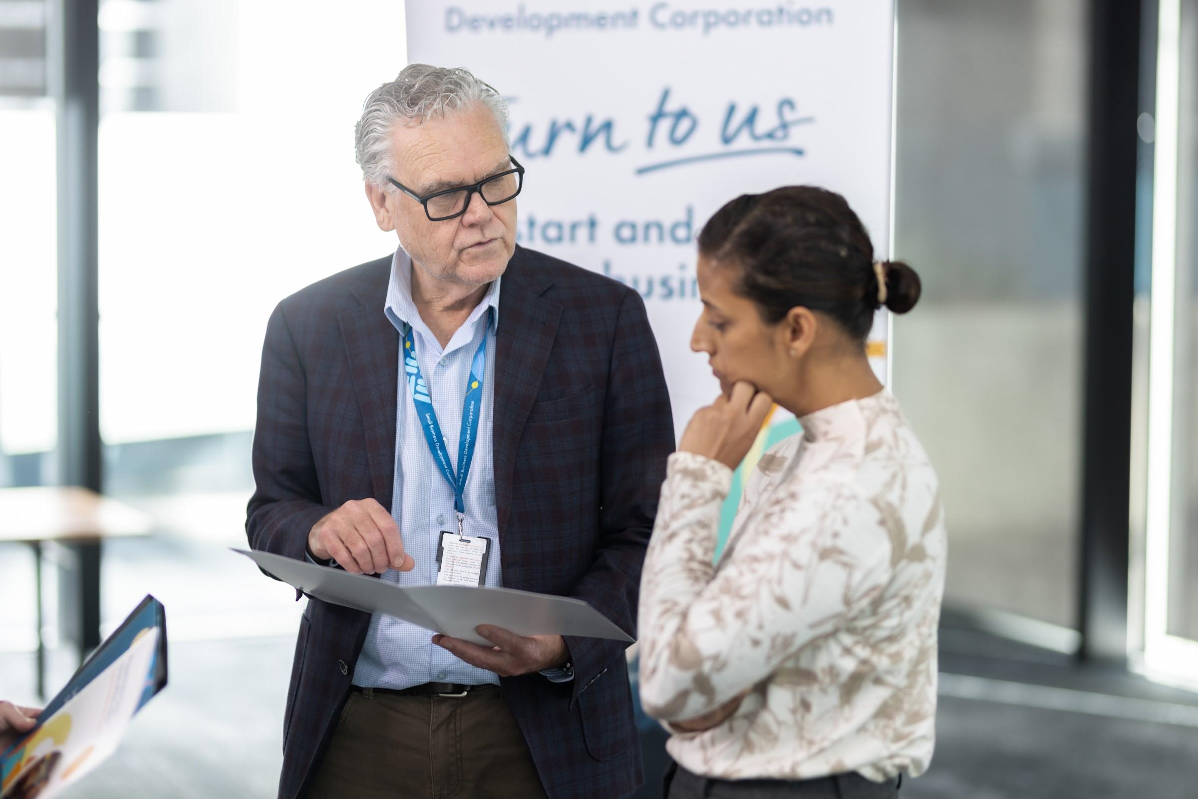 Image showing SBDC advisor speaking with small business owner.