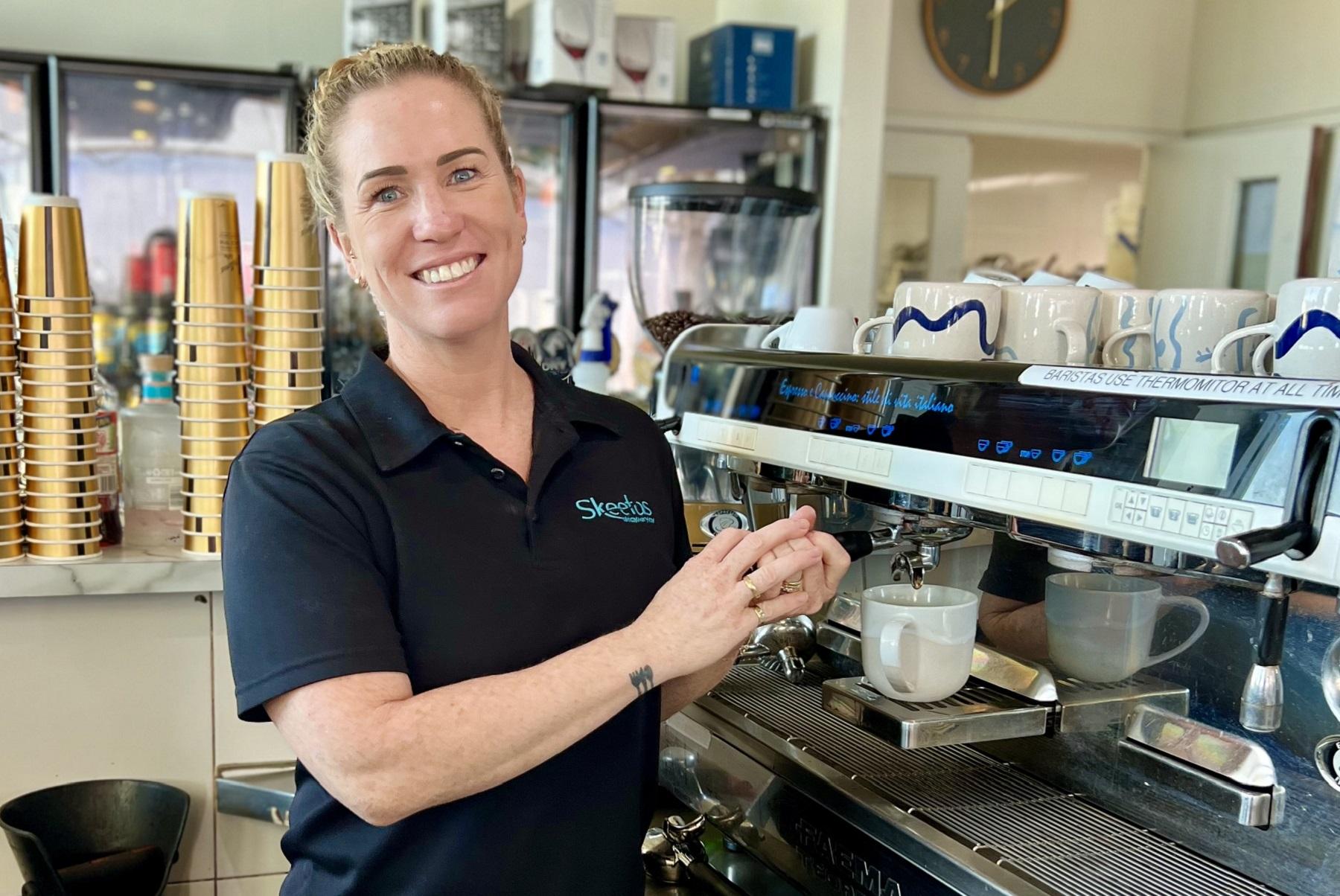 Photo of Skeetas restaurant manager Haley Morris. Haley is using standing in front of a coffee machine in the restaurant.