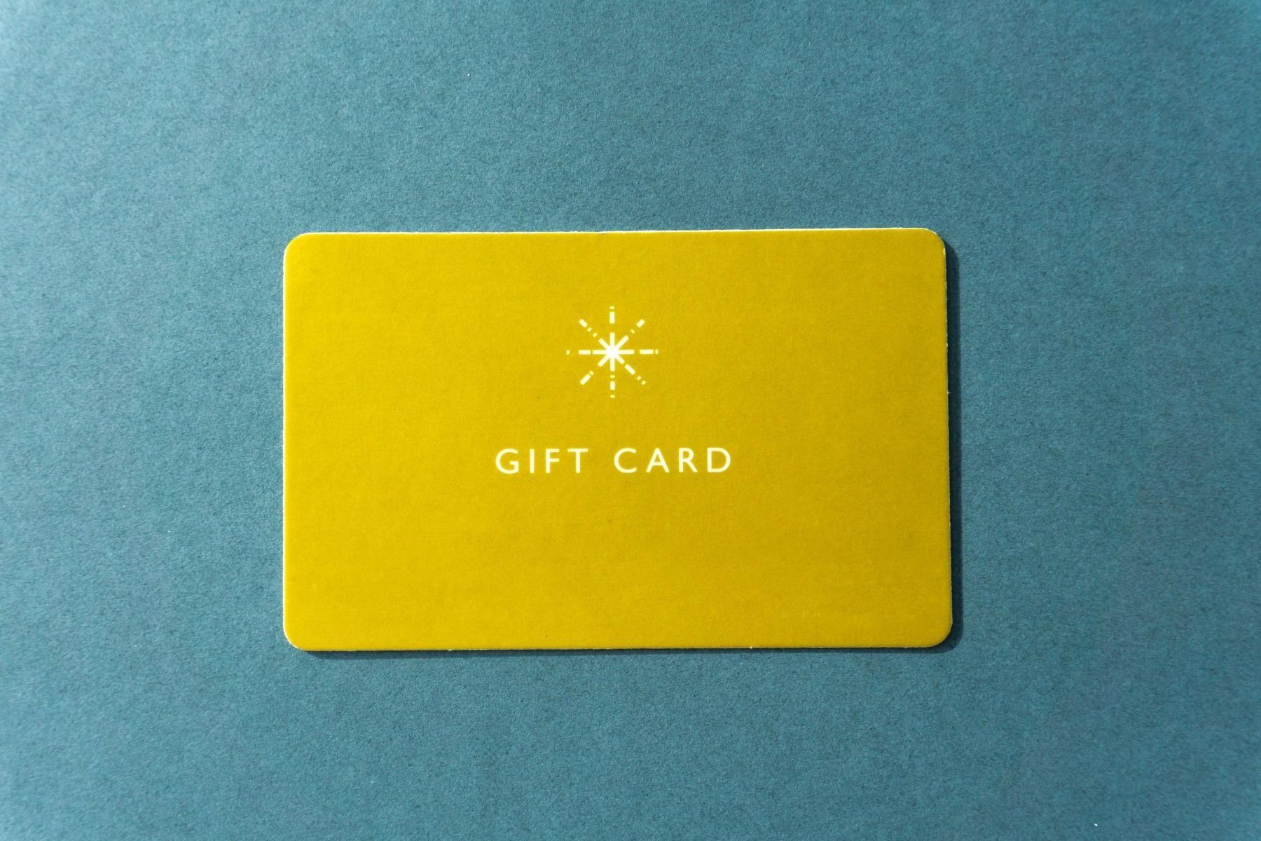 Photo of a gold coloured gift card.