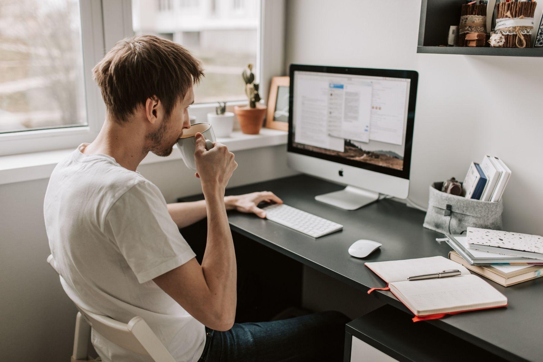 Image of a man in front of a computer