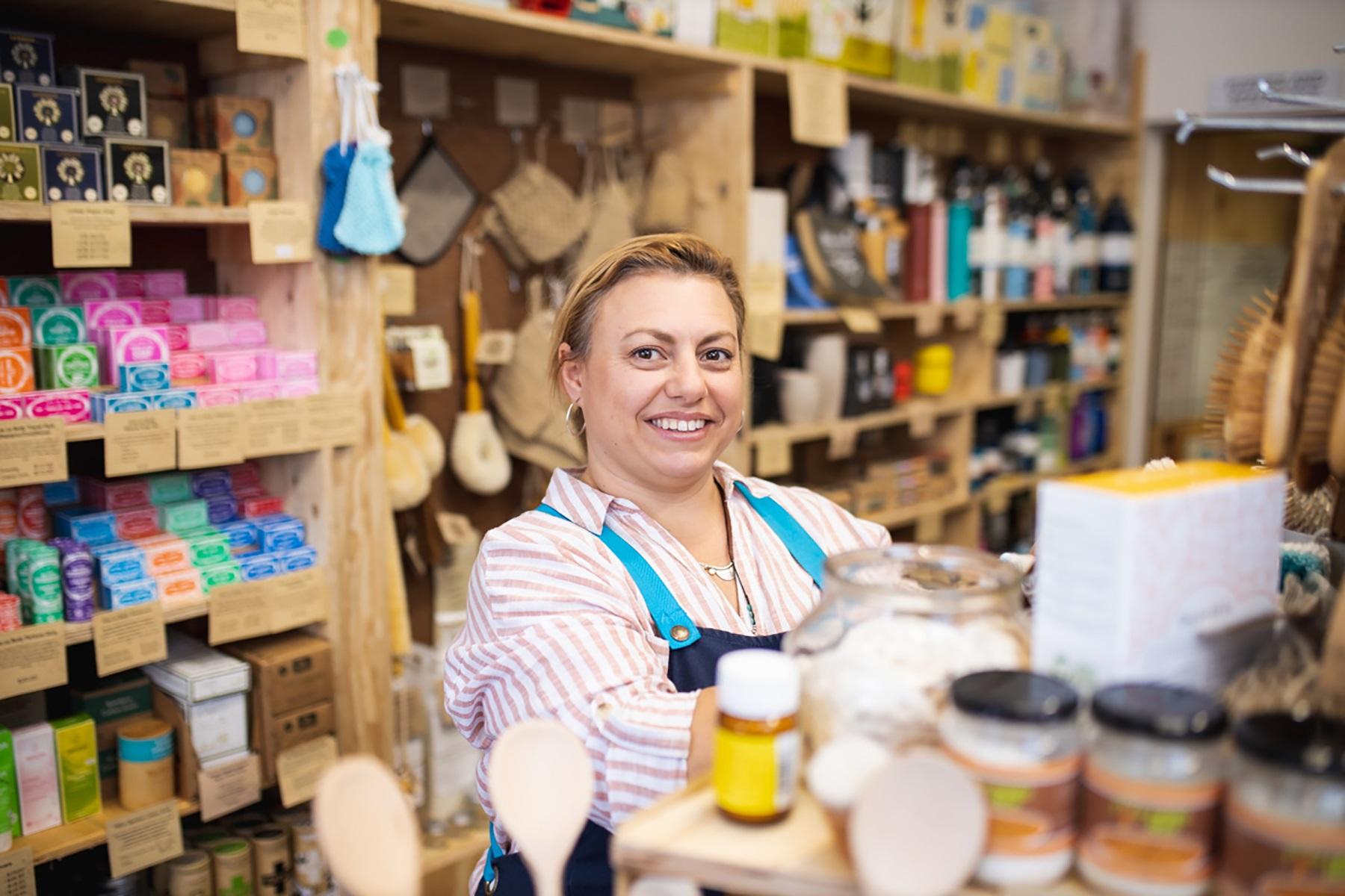 Photo of a small business owner in her retail business.