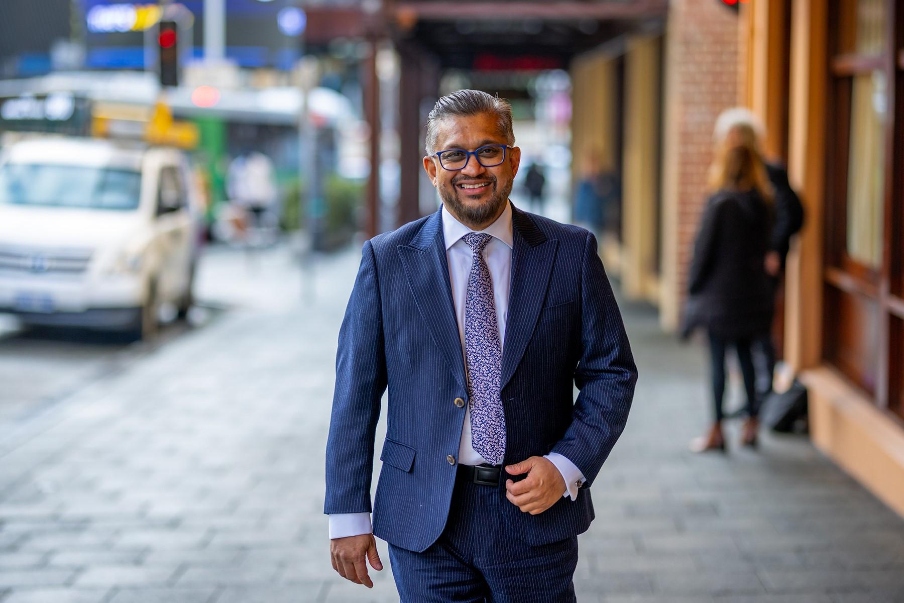 WA Small Business Commissioner Saj Abdoolakhan walking along William St in Perth''s CBD.