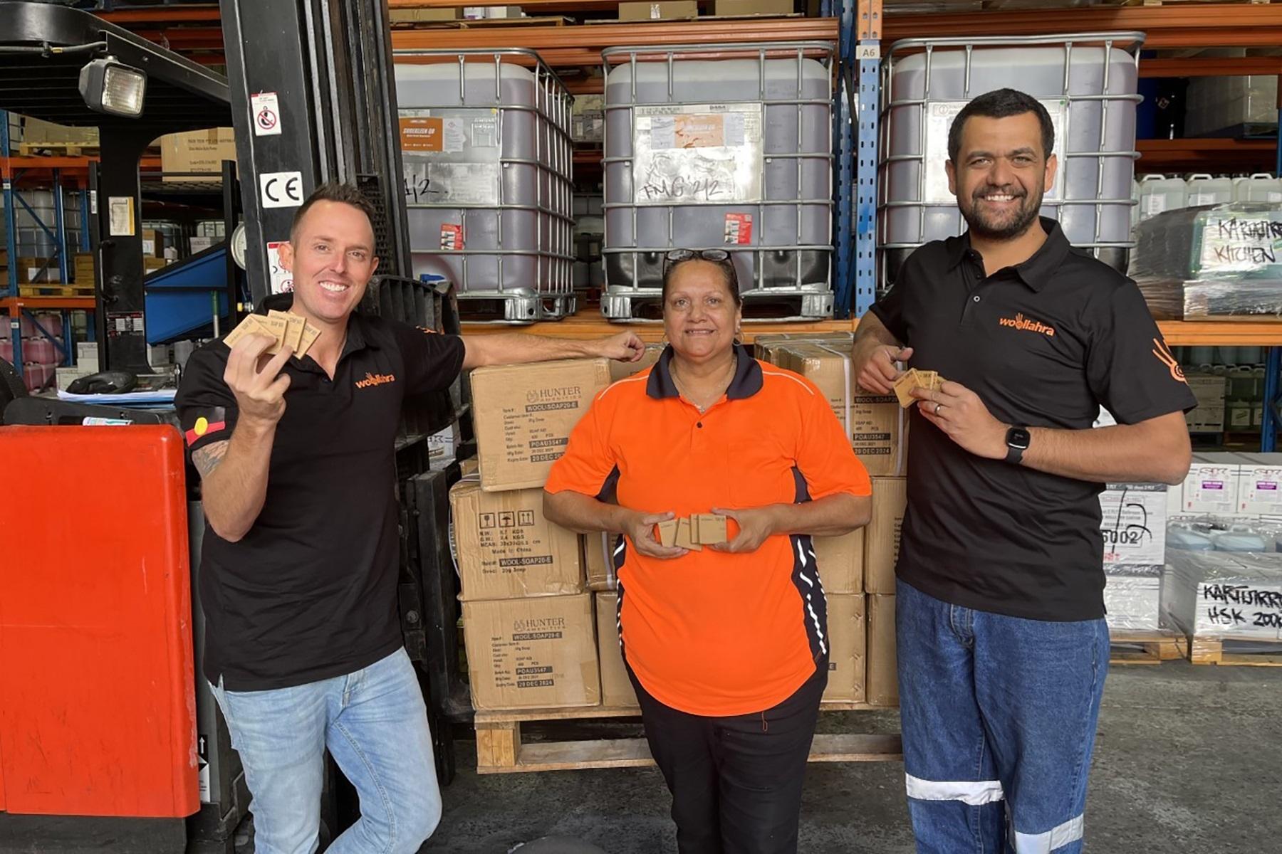 Photo of Woollahra Directors Sam Smith (left) and Reen Richards (right) with Woollahra Warehouse team member Carmel Councillor (centre) showcasing Woollahra's community focused sustainable Bar Soap.
