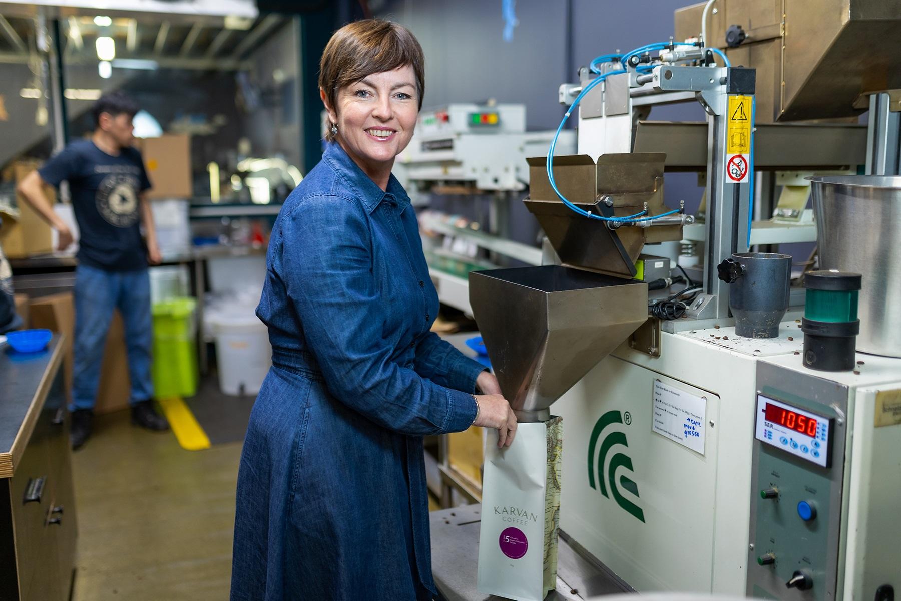 A photo of Fleur Cassidy on site of her coffee roasting facility at Leaf Bean Machine.