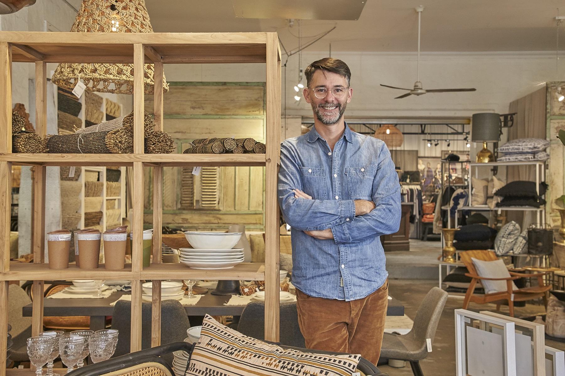 Photo of a male business owner standing in his home wares store located in the City of Vincent.