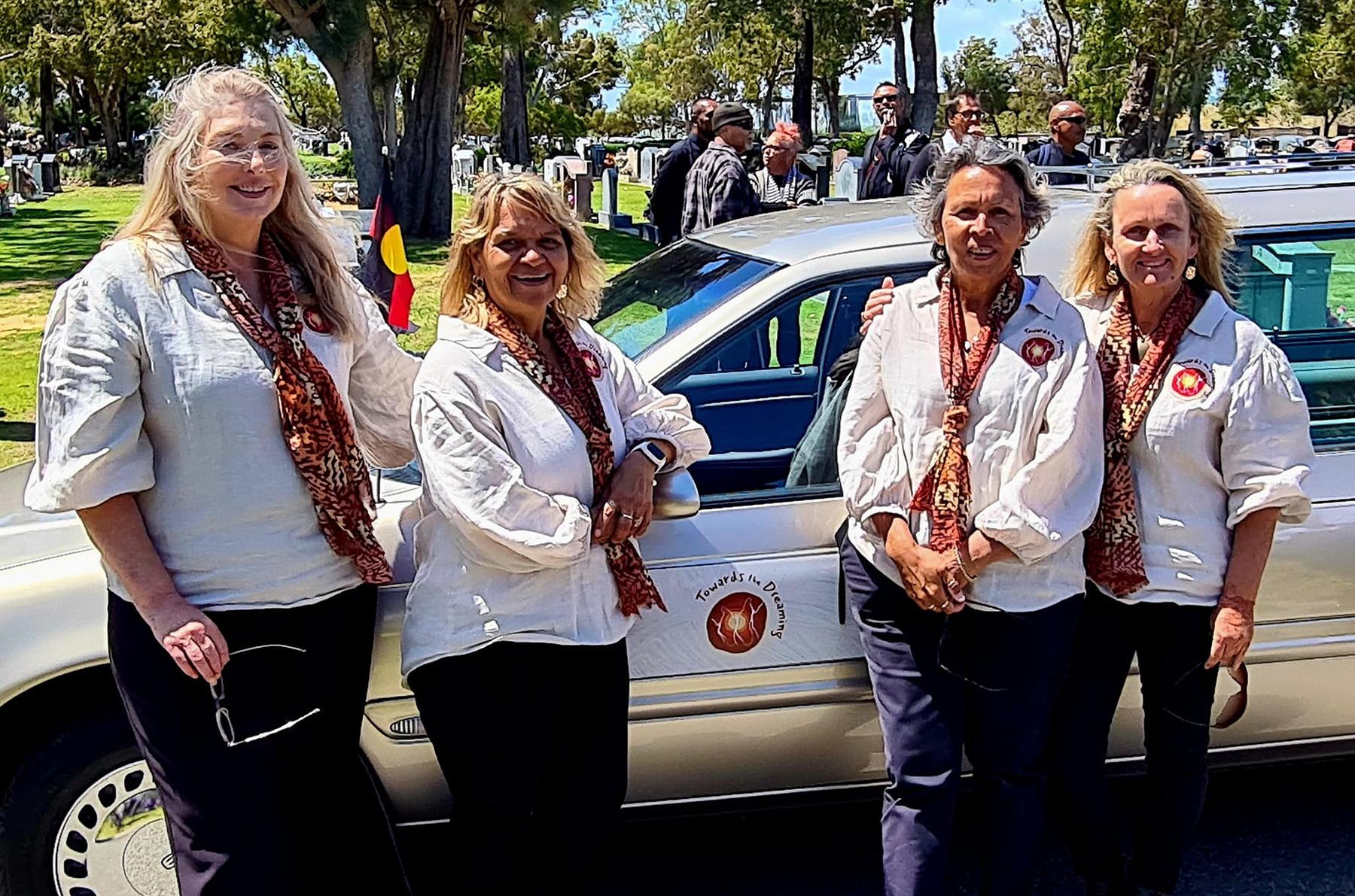 Photo of Sharon Todd, founder of Towards the Dreaming, with three of her employees.