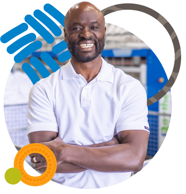 Photo of a man standing with crossed arms
