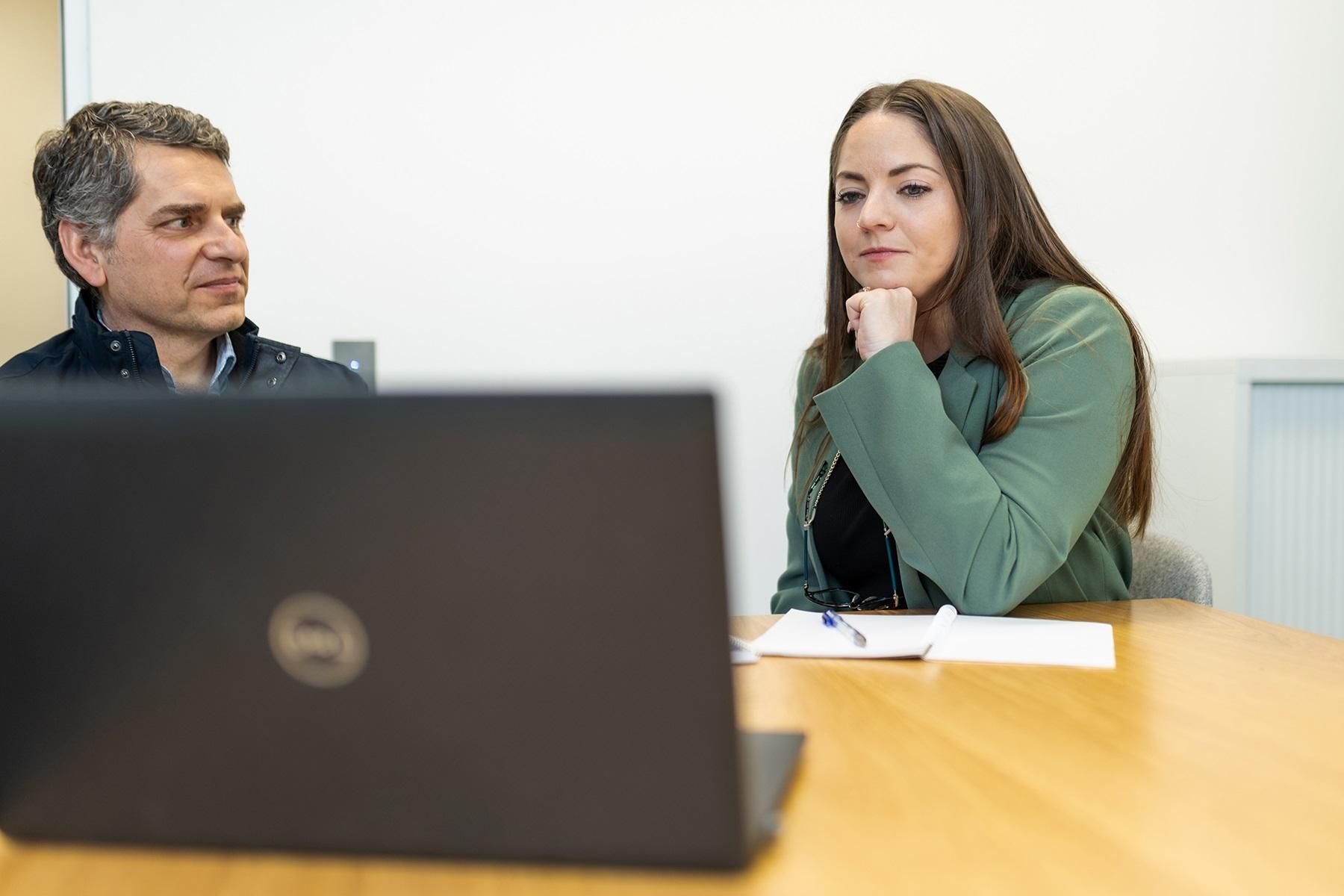 Photo of a man and woman having a conversation.