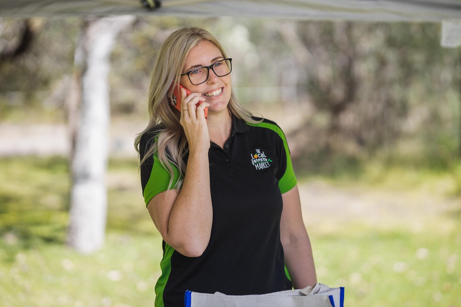 Photo of a woman speaking on a mobile phone.